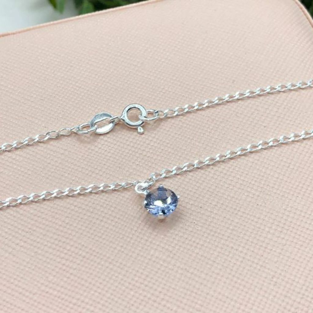 Tornozeleira de prata 925 ponto de luz roxo